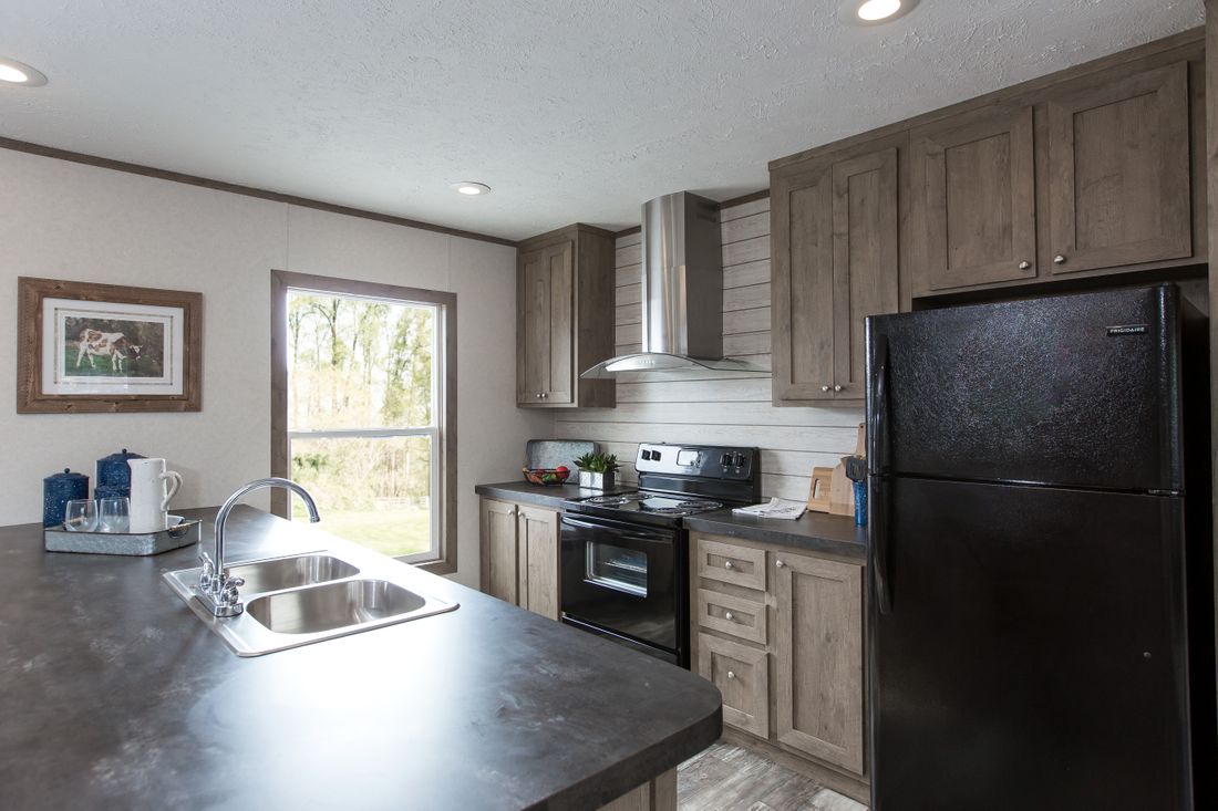 The THE BREEZE II Kitchen. This Manufactured Mobile Home features 4 bedrooms and 2 baths.