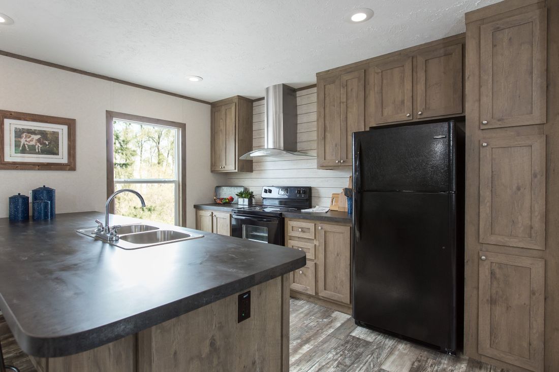 The THE BREEZE II Kitchen. This Manufactured Mobile Home features 4 bedrooms and 2 baths.