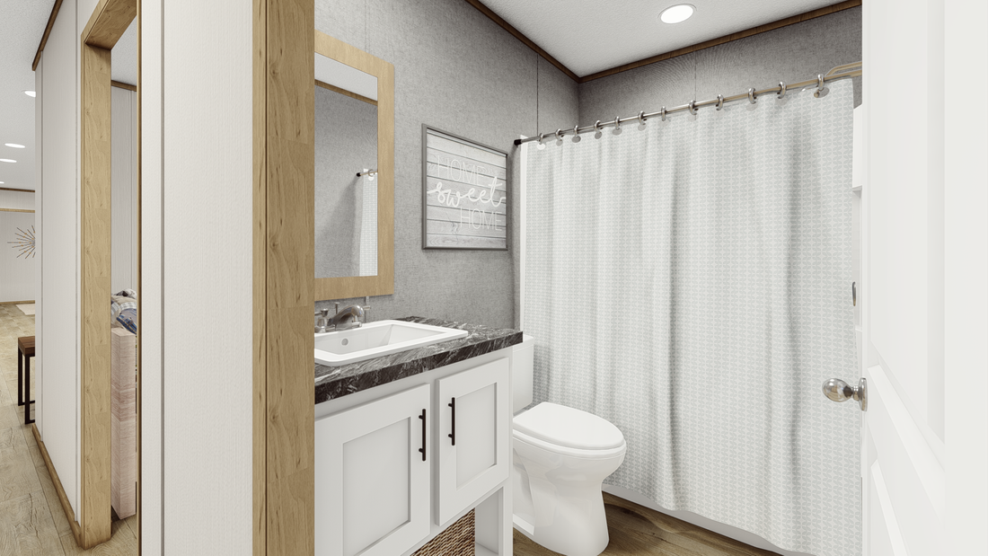 The CLARK   16X66 Guest Bathroom. This Manufactured Mobile Home features 3 bedrooms and 2 baths.